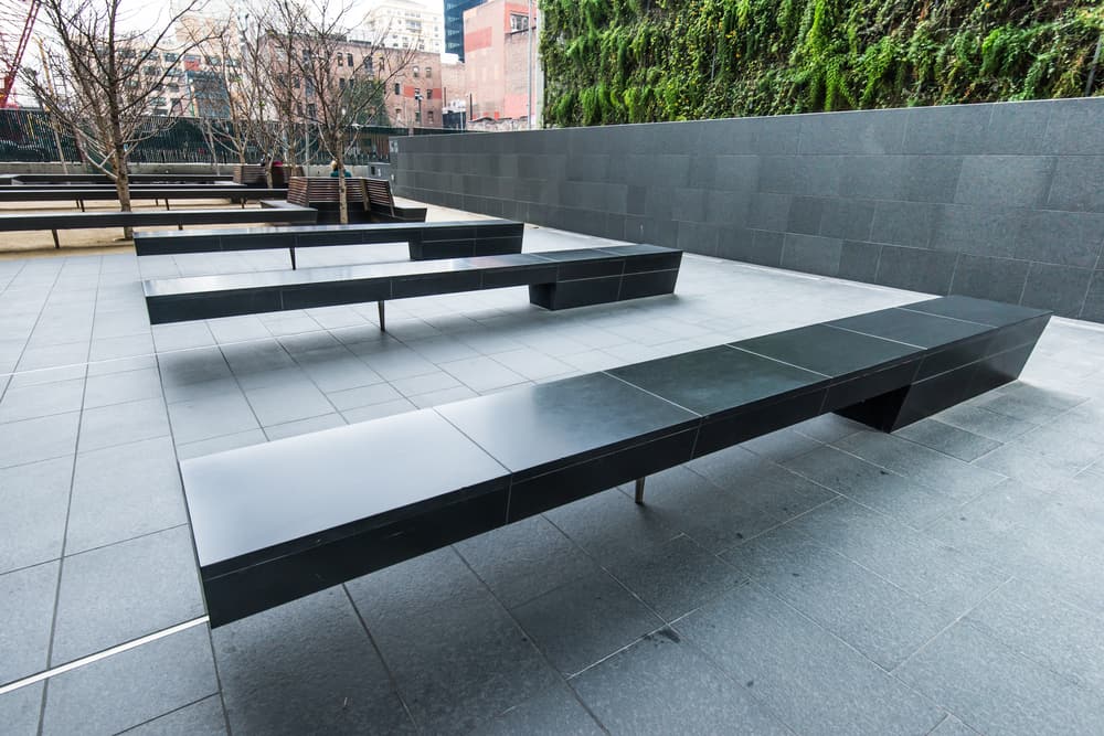 a group of benches on a patio as street furniture.